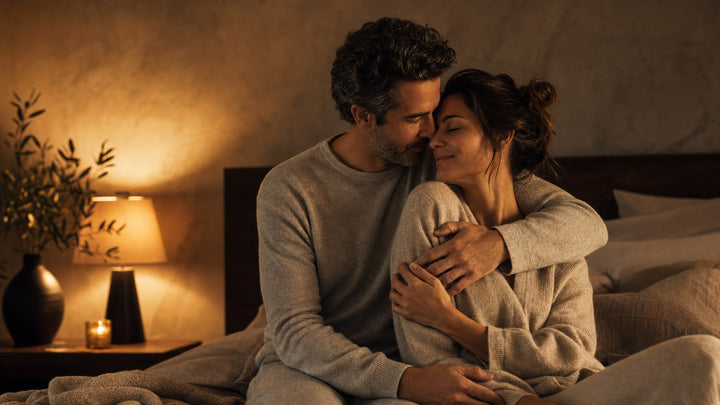 A couple embracing tenderly in a warm bedroom, bulldog sex position guide
