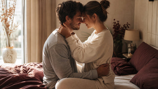 Couple embracing in a warm bedroom, triceratops sex position guide