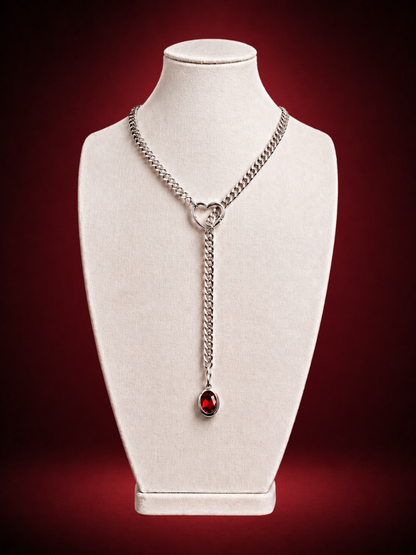 Silver lariat necklace with ruby solitaire pendant and heart-shaped clasp by Wildnightx