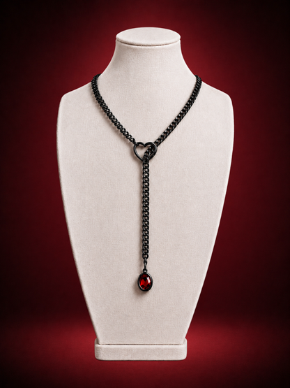 Silver lariat necklace with ruby solitaire pendant and heart-shaped clasp by Wildnightx