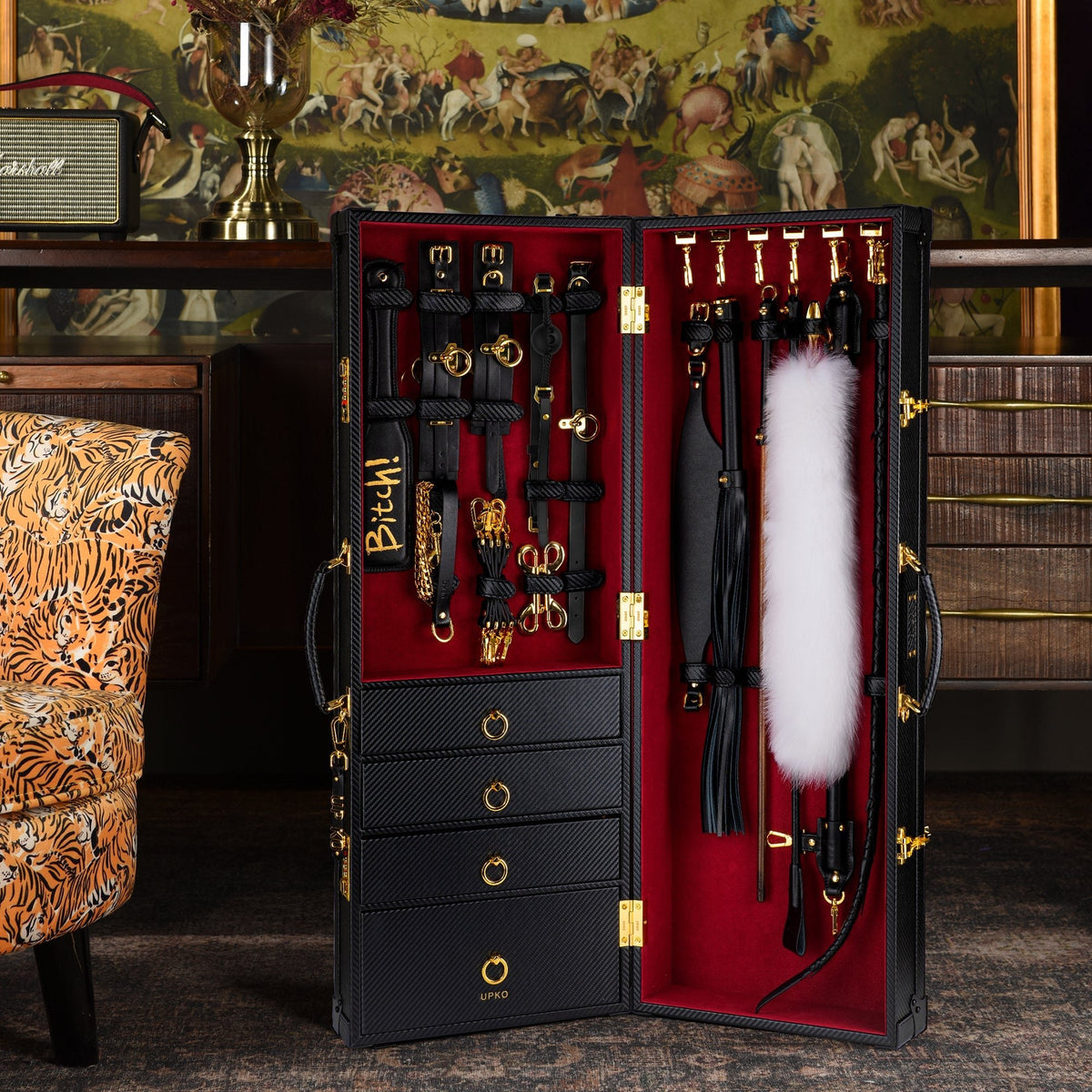 Black leather bondage trunk kit open showing tools, photo 1