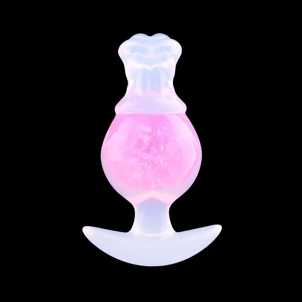 Pink silicone anal plug with anchor base