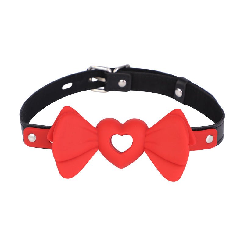 Red silicone bowknot ball gag with heart-shaped hollow design, photo 1