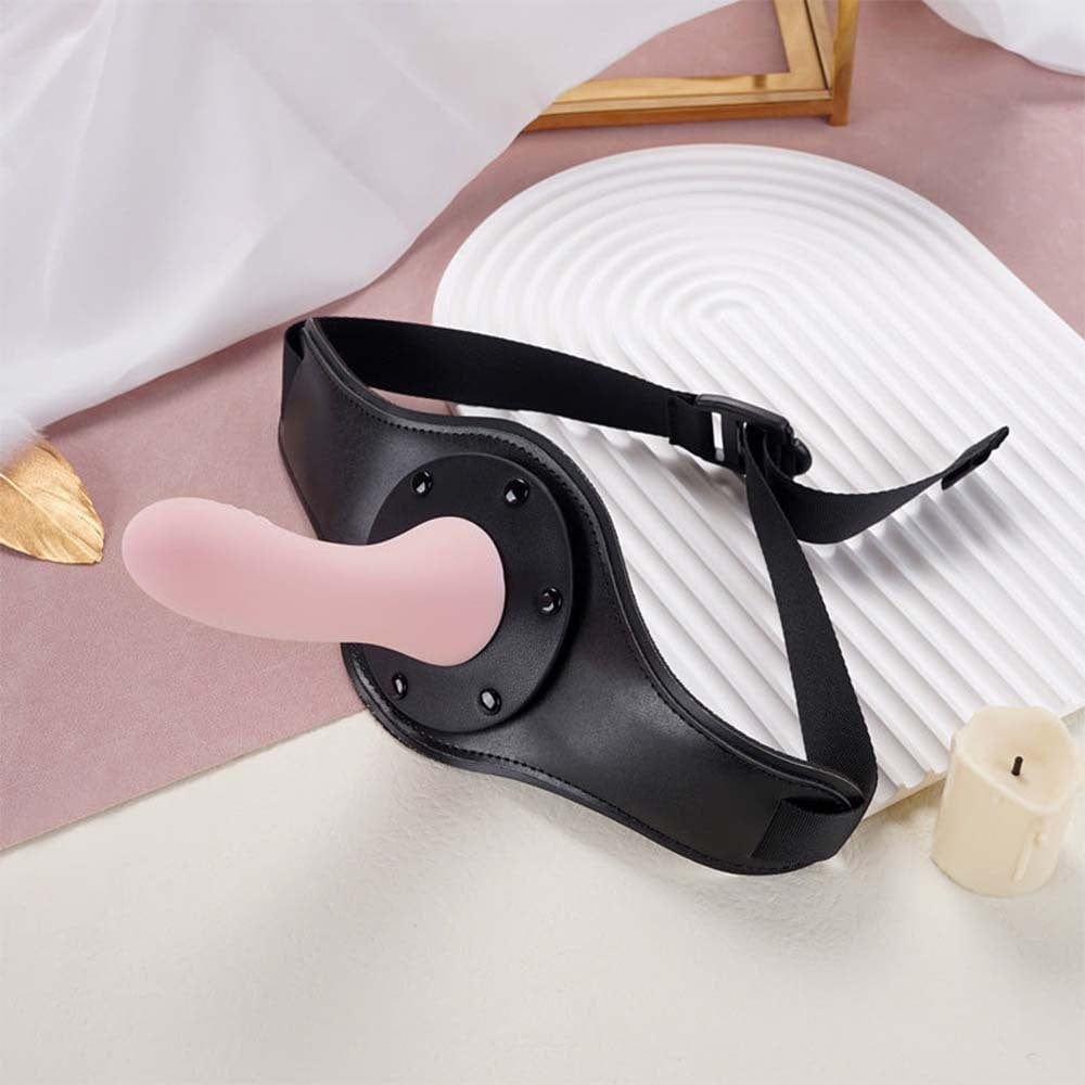 Pink silicone dildo on a black strap-on harness, photo 2