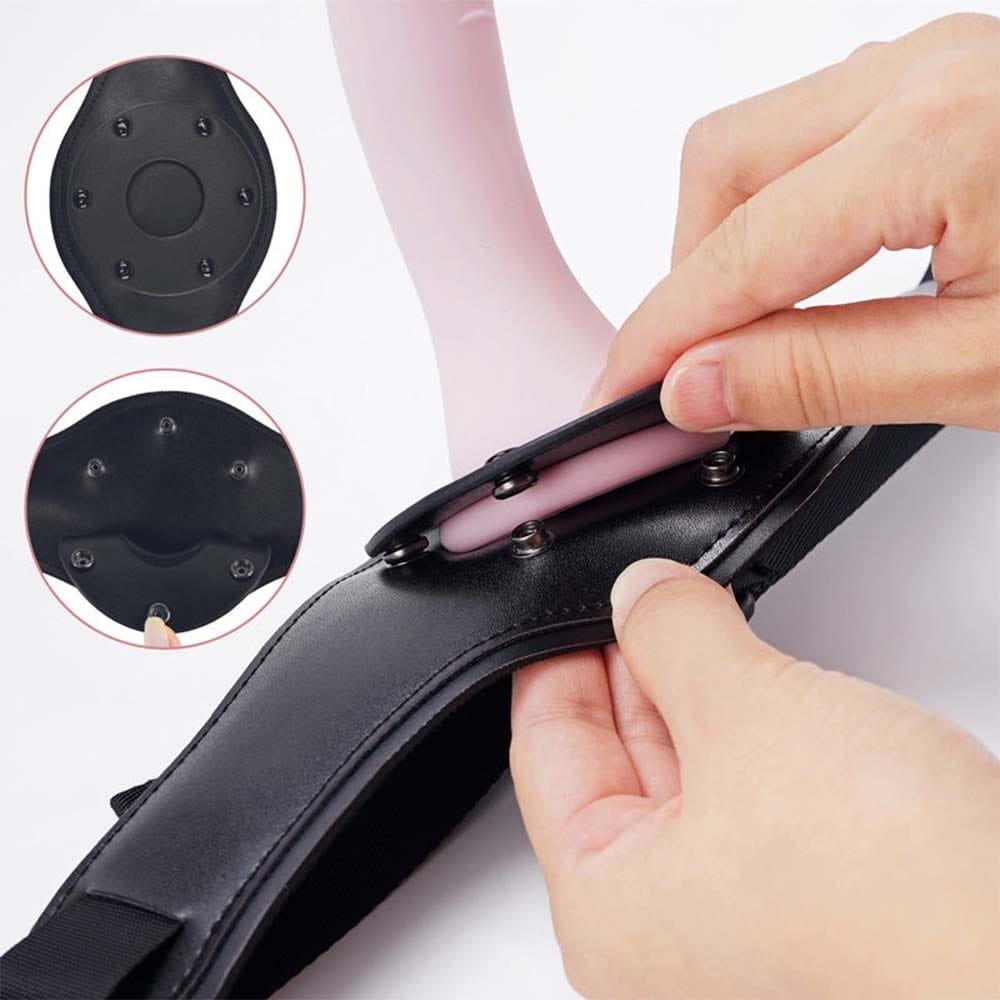 Pink silicone dildo on a black strap-on harness, photo 6