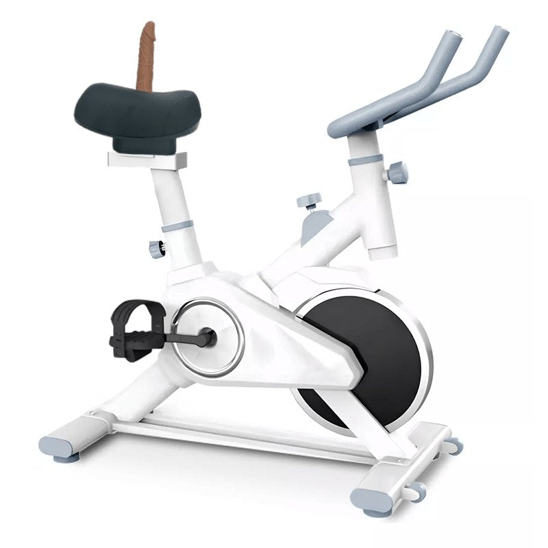 White pedal-powered bicycle sex machine with tan silicone dildo attachment, photo 1