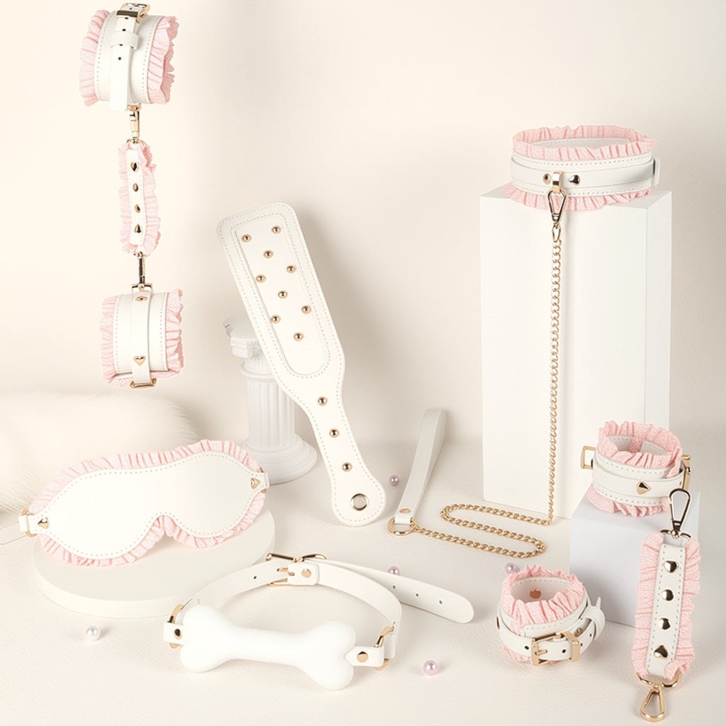 Pink and white 6-piece bondage set with blindfold, cuffs, collar, and paddle, photo 1