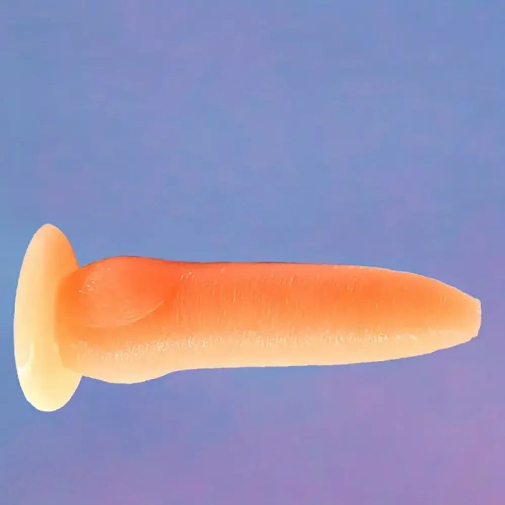 Orange realistic PVC dildo with suction cup base