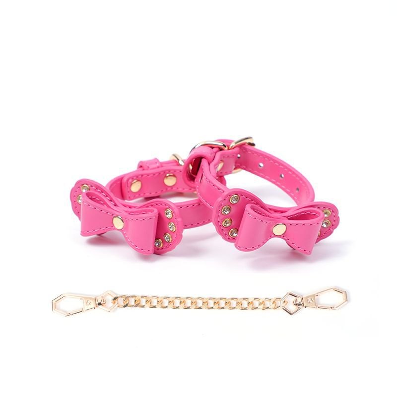 Bow-shaped PU leather handcuffs with rhinestone accents and metal chain, photo 1