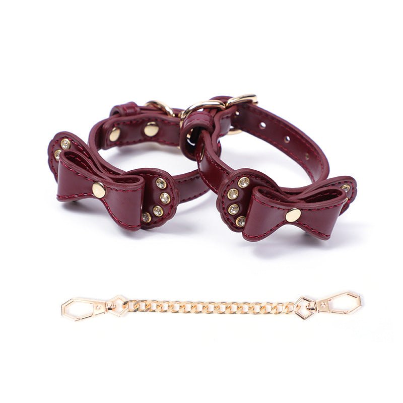 Bow-shaped PU leather handcuffs with rhinestone accents and metal chain, photo 2