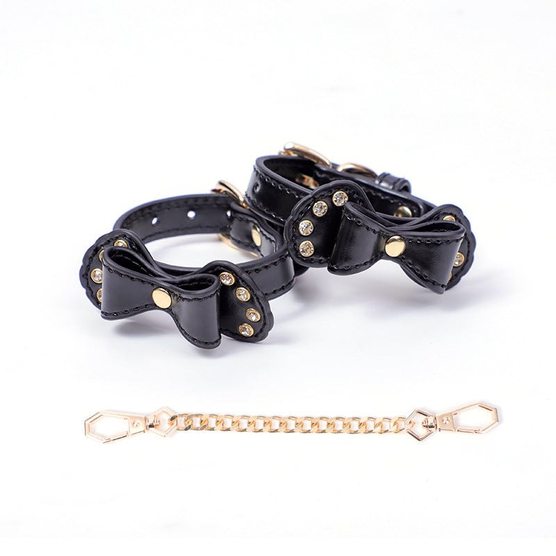 Bow-shaped PU leather handcuffs with rhinestone accents and metal chain, photo 3