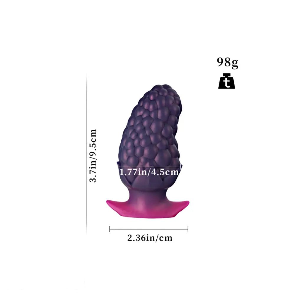 Purple strawberry textured silicone butt plug