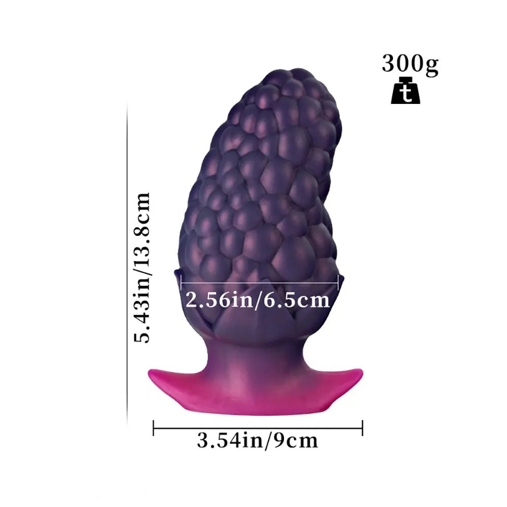 Purple strawberry textured silicone butt plug
