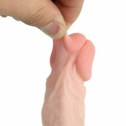 Flesh-tone vulva pocket pussy stroker with dildo shaft, photo 2