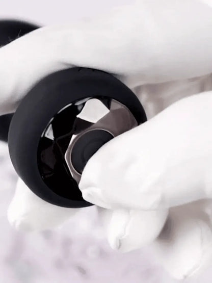 WildNightX vibrating plug held by couple, rechargeable with 10 modes for hands-free play